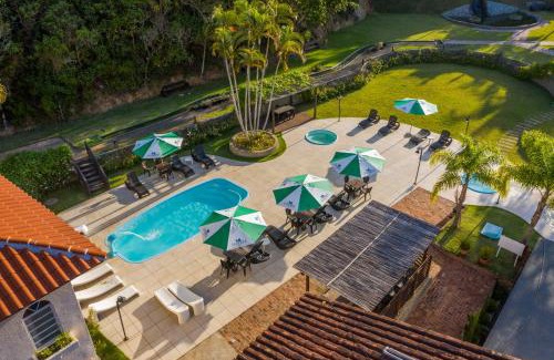 Tubarao Hotel | Discover Hotel Sandrini: Oceanfront Escape with Spa & Pool