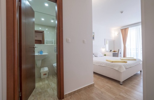 Maini Hotel | Eco-Friendly Retreat at Hotel Skyprime with Pool & Dining