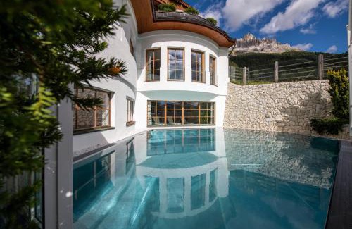 Obereggen Hotel | Discover Hotel Sonnalp: Family-Friendly Retreat with Pool