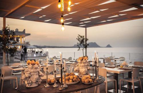 Torre Colonna-sperone Hotel | Relax at Hotel Sporting Club: 4-Star Stay with Ocean Views