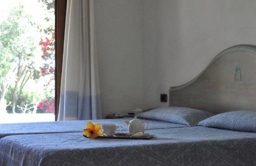 Villasimius Hotel | Relax at Su Giganti: Oceanfront Oasis with Pool & Beach