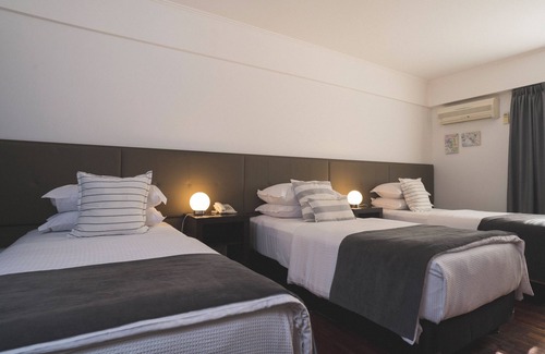 Puerto Madryn Hotel | Hotel Tolosa: Ocean View Retreat with Pool & Spa Amenities
