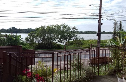 Campeche Norte House | House in front of a small lake in Campeche