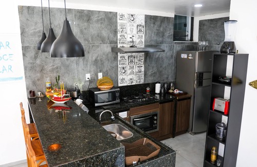 Praia Grande House | House in Praia Dos Anjos, 250m from the beach with air conditioning