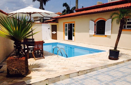 Florida House | Beachside Retreat in Praia Grande with Pool & Ocean View