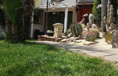Orosei Apartment | Peaceful House with Garden and Pool in Quiet Neighborhood
