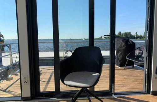 Offingawier Boat Rental | Discover a Modern Houseboat with Terrace in Offingawier
