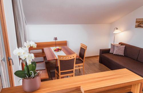 Naz Apartment | Huberhof: Family-Friendly Hotel with Oceanfront Pool