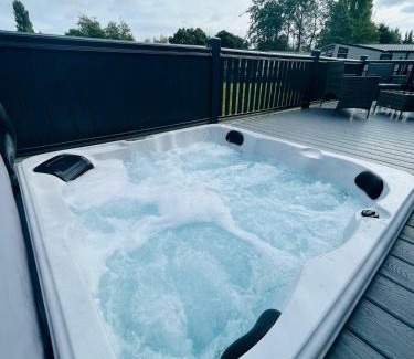 Allerthorpe House | Experience Huckleberry Lodge with Hot Tub & Pet-Friendly Access