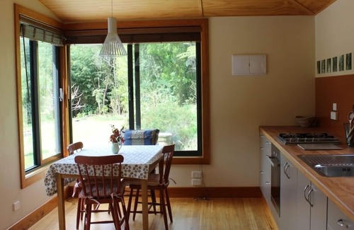 Parapara Cottage | Serene Riverside Retreat with Oceanfront Views & Breakfast