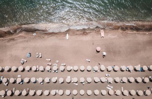 Lido di Capo Portiere Hotel | Discover Il Fogliano Hotel with Oceanfront Relaxation