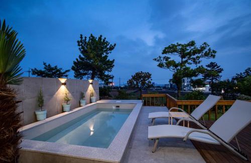 Andeok House | Elegant Oceanfront Retreat at Ililsagye with Pool Access