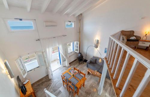 Agios Georgios Pagon Apartment | Experience ILIOS: Guest Rated 9.7 with Oceanfront Views