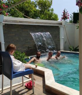 Durres House | Inviting Poolside Rooms with Garden Views for Your Stay
