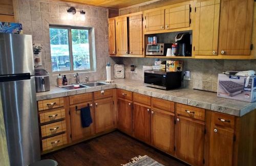 Pickens House | Impressive Cabin Surrounded by Trees in Nashoba, Oklahoma