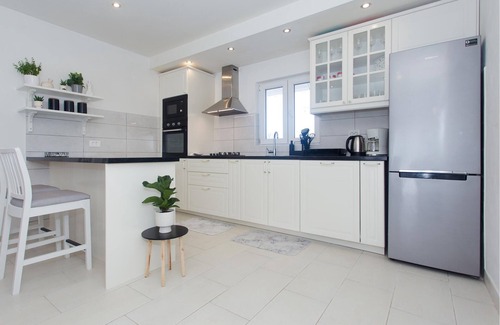 Srijane House | In Srijane in the Dalmatian hinterland is located this semi-detached house, which is spread over two