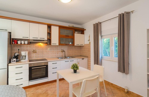 Trnbusi House | In the hinterland of Omis you will find this stylishly furnished, extremely spacious vacation home w