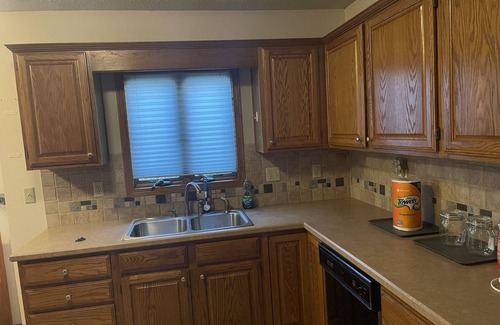 Greenwich House | Convenient Hotel Steps from Walmart, Starbucks & Dining