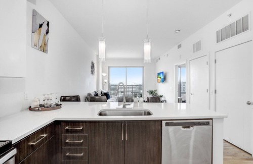 Channel District Apartment | Indulge in a City View Sky Lounge & Top Gym Access