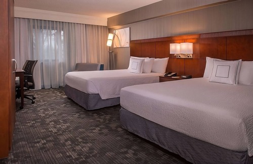 Columbia Hotel | Experience Homely Comfort Near Lake Kittamaqundi with Pool