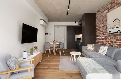 St Kilda Condo | Industrial Style Retreat on Chapel Street for Families