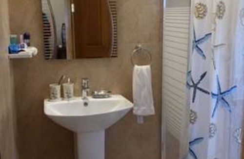 San Juan Bed & Breakfast | Relax at Infinity Sands Resort with Pool and Restaurant Access