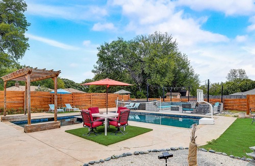 Sachse House | Inviting dog-friendly home with pool, full kitchen, central AC, & W/D