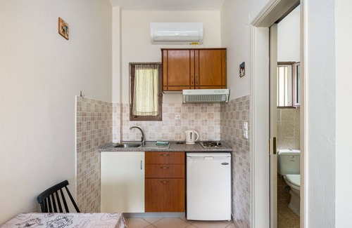 Ipsos Apartment | Relax at Ipsos Pool Apartments: Family-Friendly Retreat