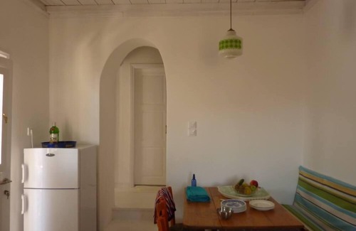 Arnados House | Experience ISimoni: Oceanfront Haven in Tinos, Rated 9.6