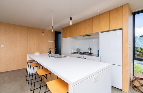 Mangawhai House | Island View: Designer Holiday Home with Spectacular Views