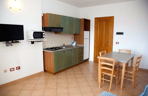Trinita d'Agultu e Vignola Apartment | Isola Rossa Borgo Mare: Oceanfront Oasis with Spa & Pool