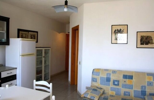 Trinita d'Agultu e Vignola Apartment | Isola Rossa Borgo Mare: Oceanfront Oasis with Spa & Pool