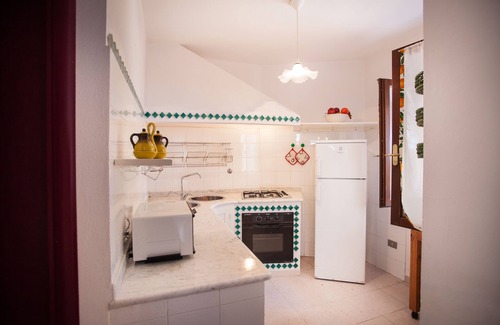 Cala Liberotto Apartment | Beachfront LA PIGNA Apartment: 10/10 Guest Rated Retreat