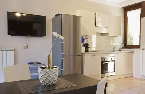 Maccagno con Pino e Veddasca Apartment | Elegant Studio Apartments with Pool and Lake View Amenities
