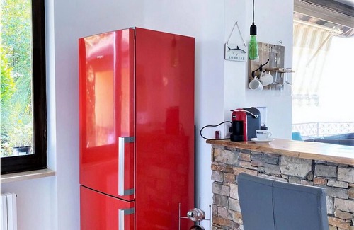 Pino Lago Maggiore Apartment | Belvilla by OYO: Inviting Holiday Home with Garden Oasis