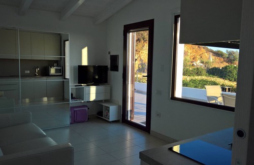 Villaggio delle Mimose Apartment | Idyllic Apartment with Pool and Ocean Views Near Villasimius