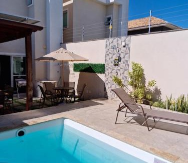 Praia do Morro House | Inviting Ivana Imoveis: Poolside Retreat Steps from Beach