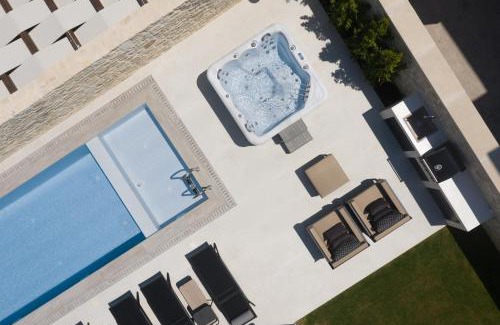 Perama Villa | Ivory Villa: Elegant Oceanfront Escape with Pool & Hot Tub