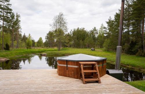 Hiiu House | Inviting Jõeranna Pond House with Hot Tub & Family Fun