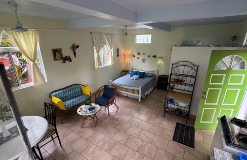 Calibishie Apartment | Jacoway Inn Gardenia Studio - open garden view, peace, privacy and relaxation