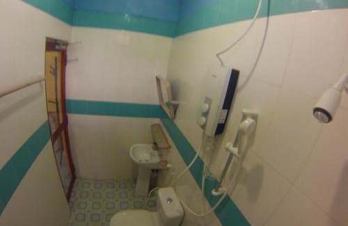 Himmafushi House | Cozy Jail Break Surf Inn: Ocean Views & Family-Friendly Stays