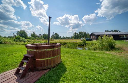 Bernati House | Explore Jaunie Pātari: Oceanfront Retreat with Hot Tub