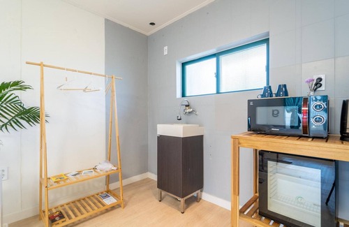 Jungmun House | Family-Friendly Jeju Dalbam Pension with Kitchen Amenities