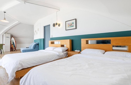 Aewol House | Explore Jeju UFO Pension: Family-Friendly Stay with Kitchen