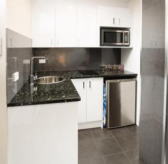 Jesmond Apartment | Relax at Jesmond Executive Villas with Pool & Spa Amenities