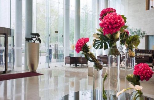Dongdan Hotel | Indulge at Jianguo Garden Hotel: 5-Star Retreat with Spa & Pool