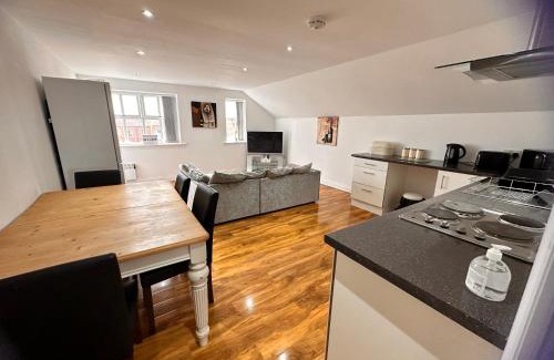 Withernsea Apartment | Discover Comfort at Joe Kelly Buildings C - Family Friendly Stay