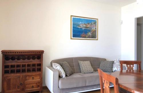 Azzano Apartment | Joy Apartment: Oceanfront Retreat with Pool & High Ratings