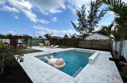 Lake Worth House | Experience Jungle Cottage: Pool, Hot Tub & Ocean Views