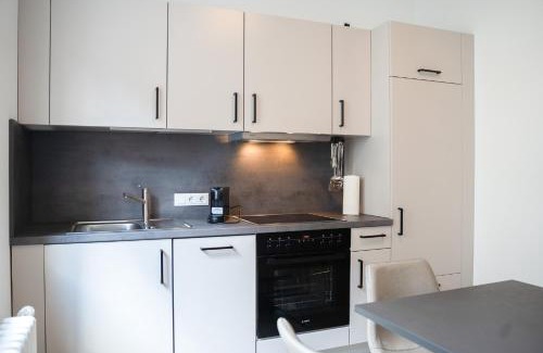 Oberhausen Apartment | Modern JUNIK Apartments Oberhausen - Family-Friendly Stay